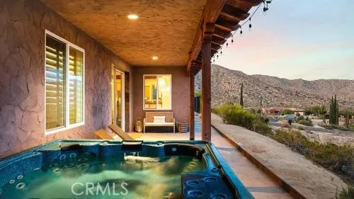 a view of swimming pool with an outdoor seating