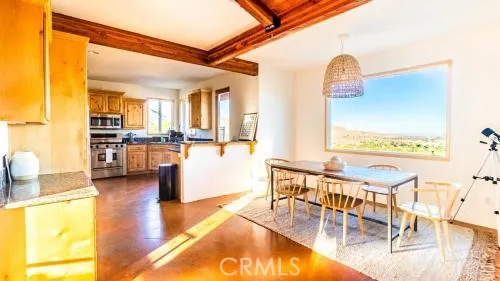a view of a living room and dining room