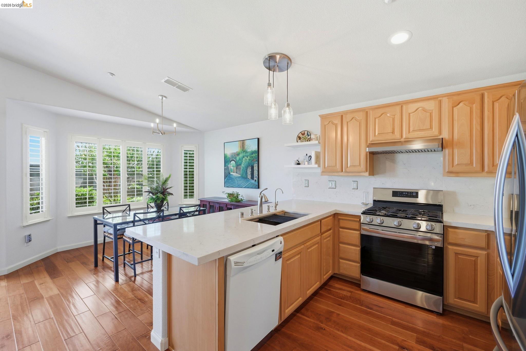 1024 Diamante Rio Vista, CA 94571 - Photo 8 of 27 Kitchen with light wood cabinetry, stainless steel appliances, and a white countertop island