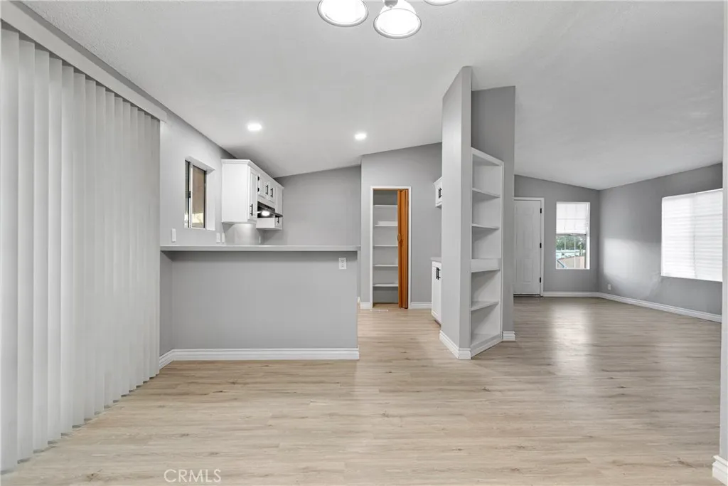 8450 G, Unit 63 Hesperia, CA 92345 - Photo 12 of 31 a view of a kitchen with wooden floor and a window