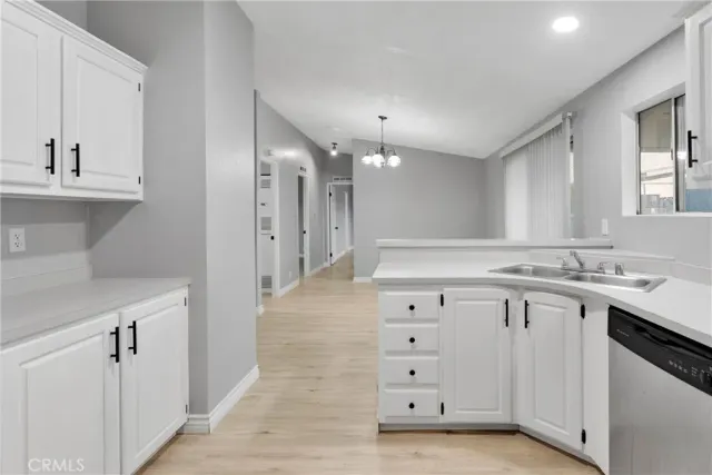 a bathroom with a sink vanity and a mirror