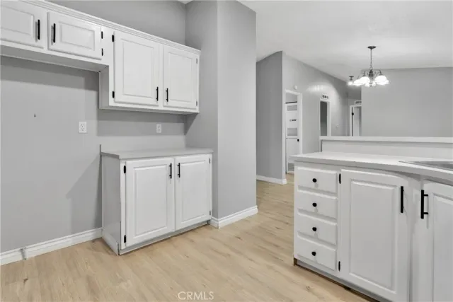 a view of cabinets and wooden floor