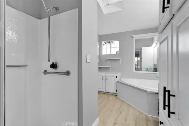 a bathroom with a bathtub and a sink