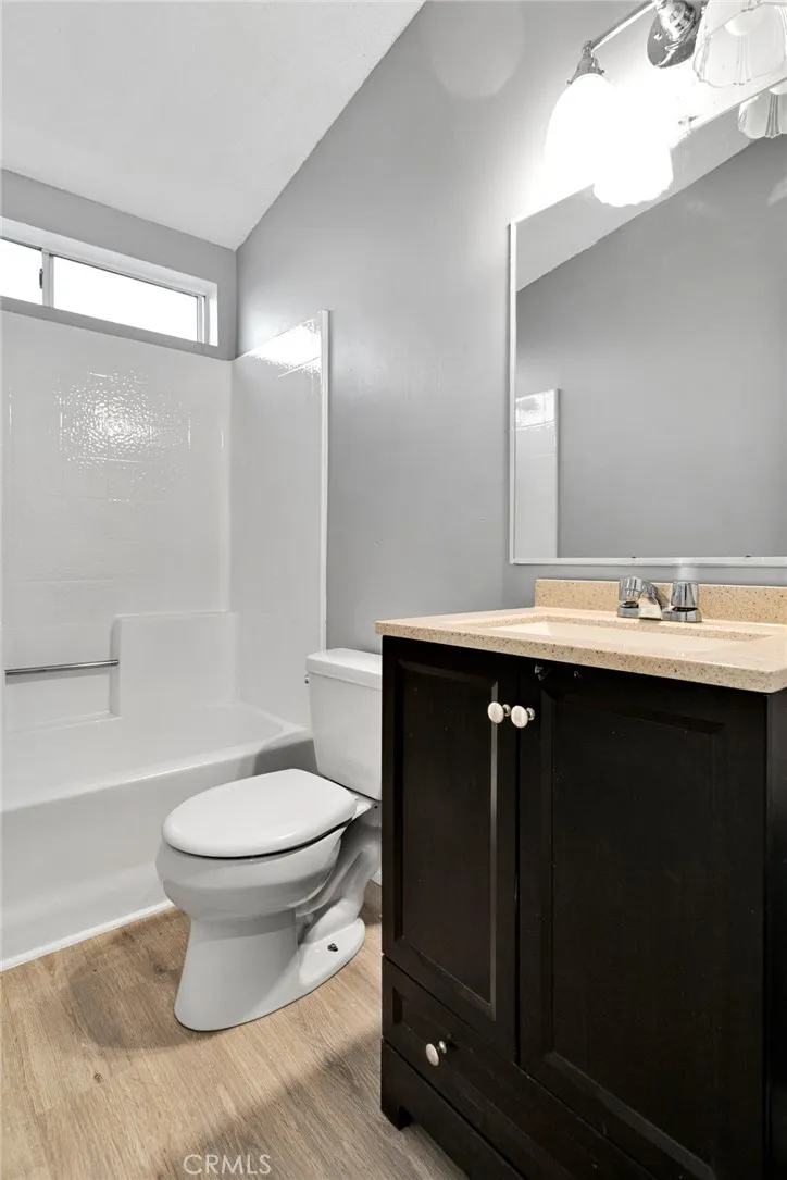 8450 G, Unit 63 Hesperia, CA 92345 - Photo 26 of 31 a bathroom with a sink and a toilet