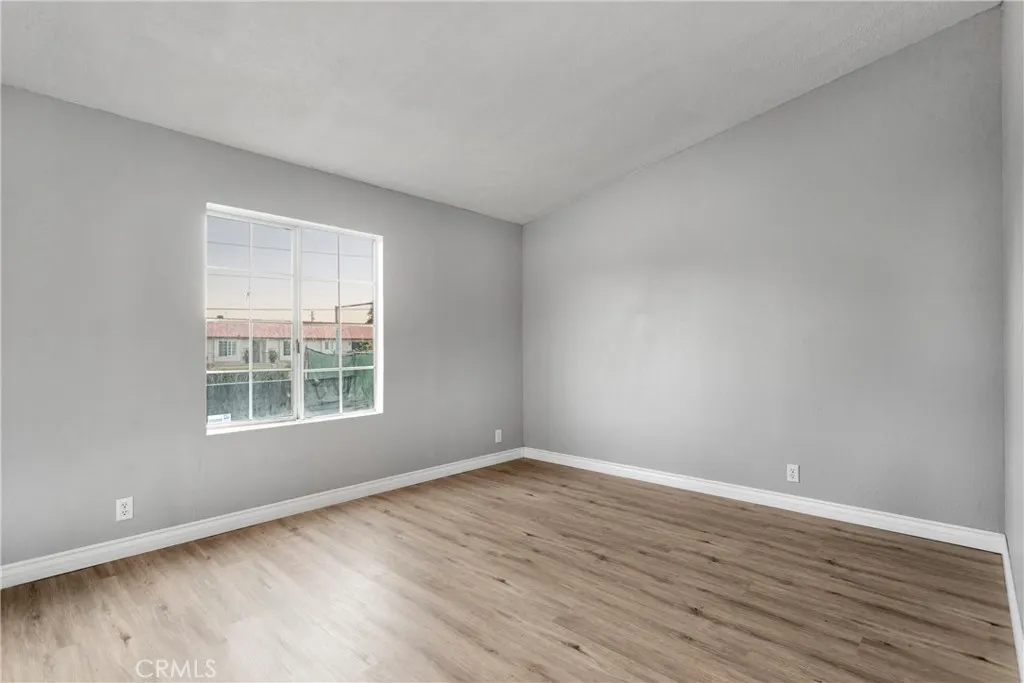 8450 G, Unit 63 Hesperia, CA 92345 - Photo 27 of 31 wooden floor in an empty room with a window