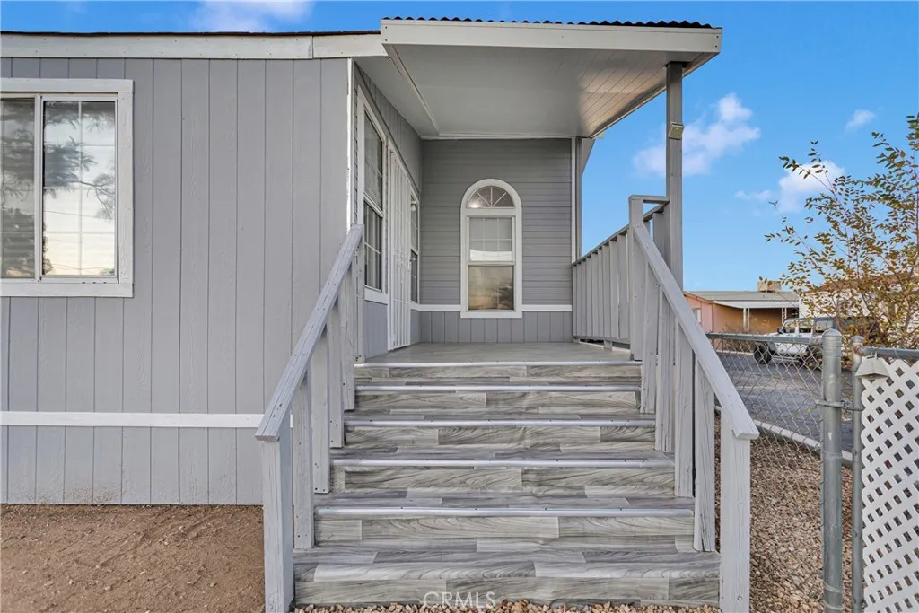 8450 G, Unit 63 Hesperia, CA 92345 - Photo 6 of 31 a view of entryway and hall with wooden floor