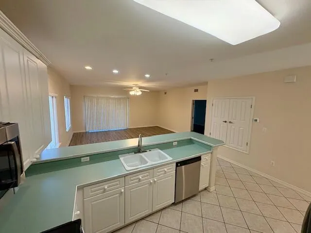 a kitchen with a sink and cabinets