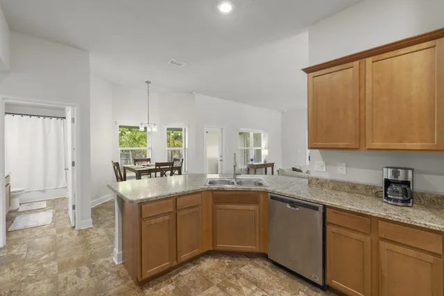 a bed room with a bed and a ceiling fan