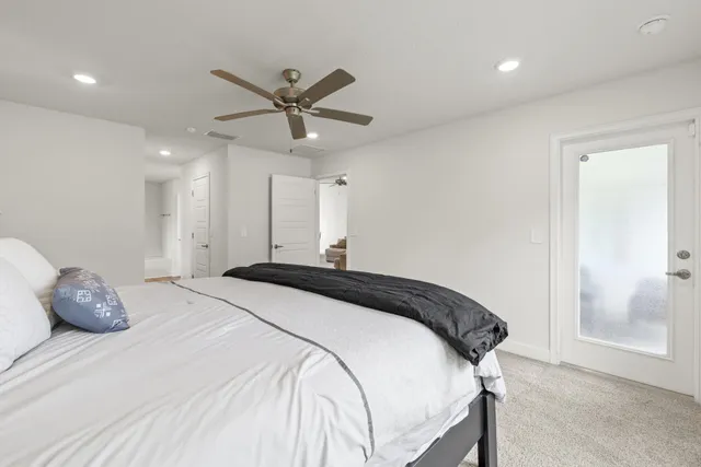 a bathroom with a granite countertop sink and a bathtub