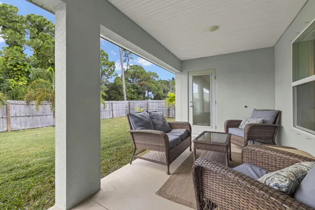 front view of house with a bench and a bench