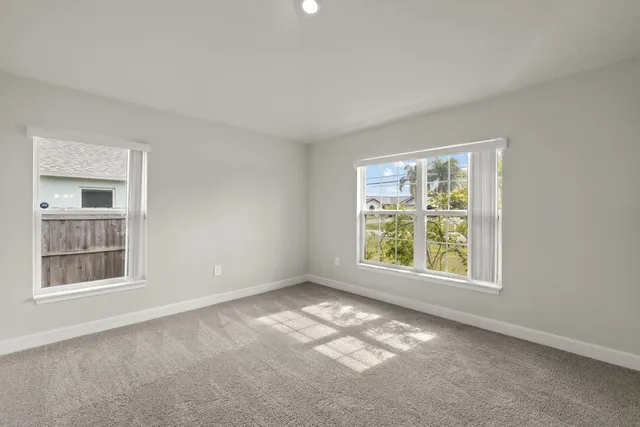 a view of a dining room with furniture wooden floor and chandelier