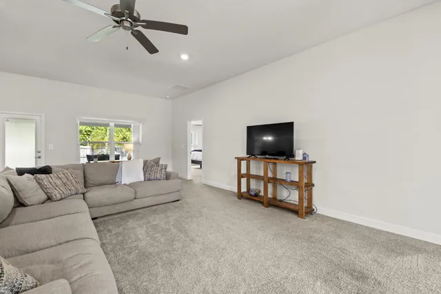 a view of a dining room with furniture and window