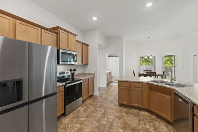 a kitchen with a sink and cabinets