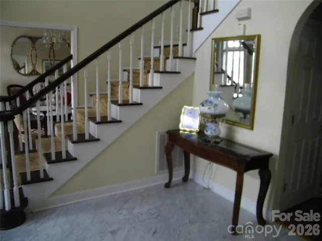 a living room with furniture window and wooden floor