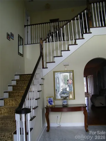 a kitchen with a refrigerator and a stove
