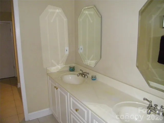 a kitchen with a refrigerator and a stove