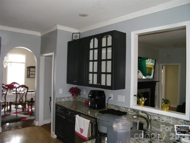a kitchen with a stove and a refrigerator