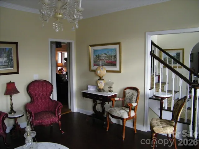 a very nice looking dining room with a table and a chandelier