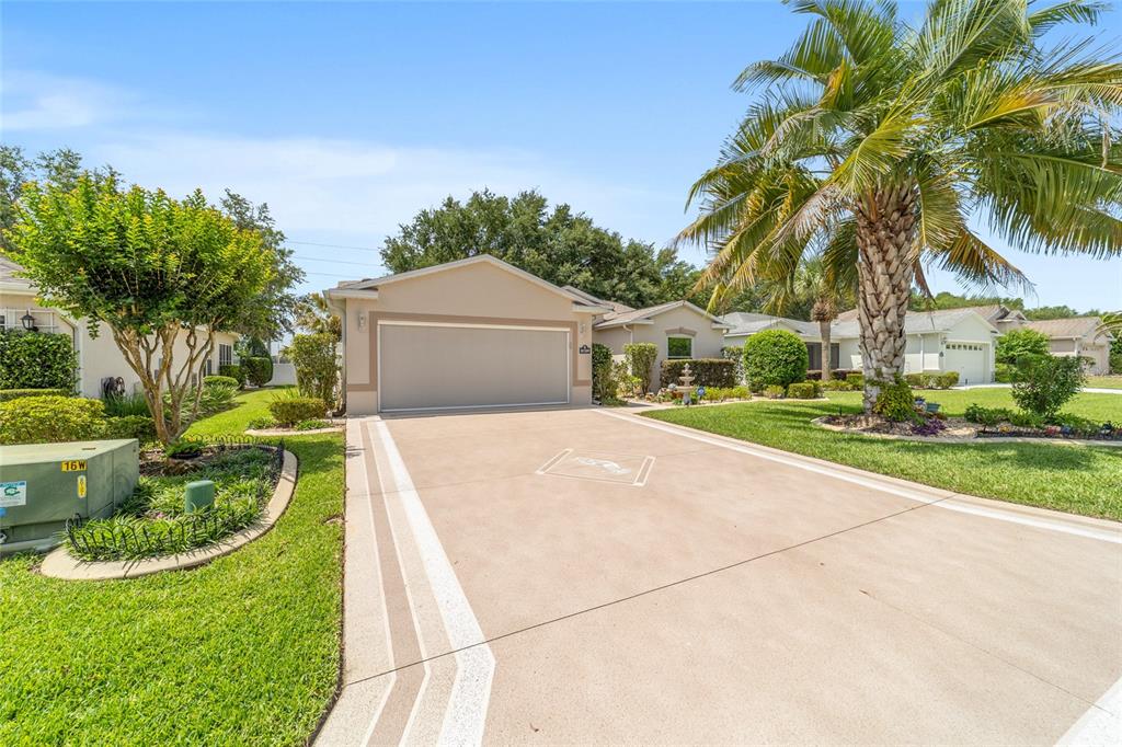 16369 Southwest 14th Avenue Road Ocala, FL 34473 - Photo 2 of 49 a view of a house with palm trees