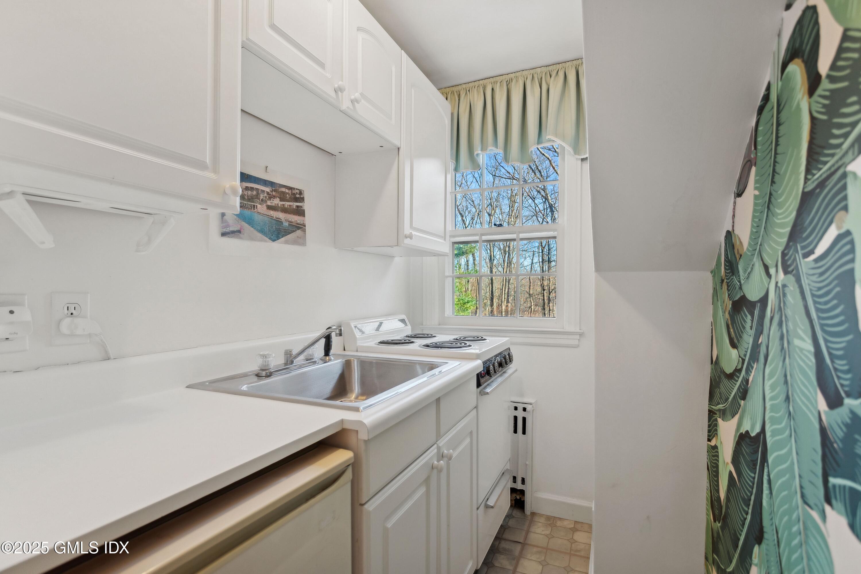 2 Laurel Road Stamford, CT 06903 - Photo 16 of 24 a kitchen with a sink and a window