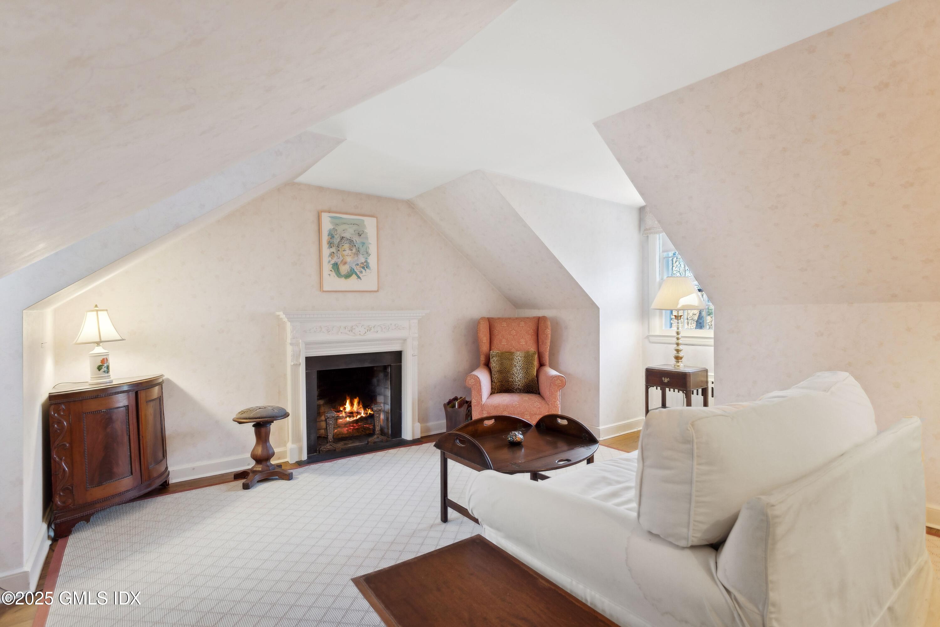 2 Laurel Road Stamford, CT 06903 - Photo 17 of 24 a living room with furniture and a fireplace