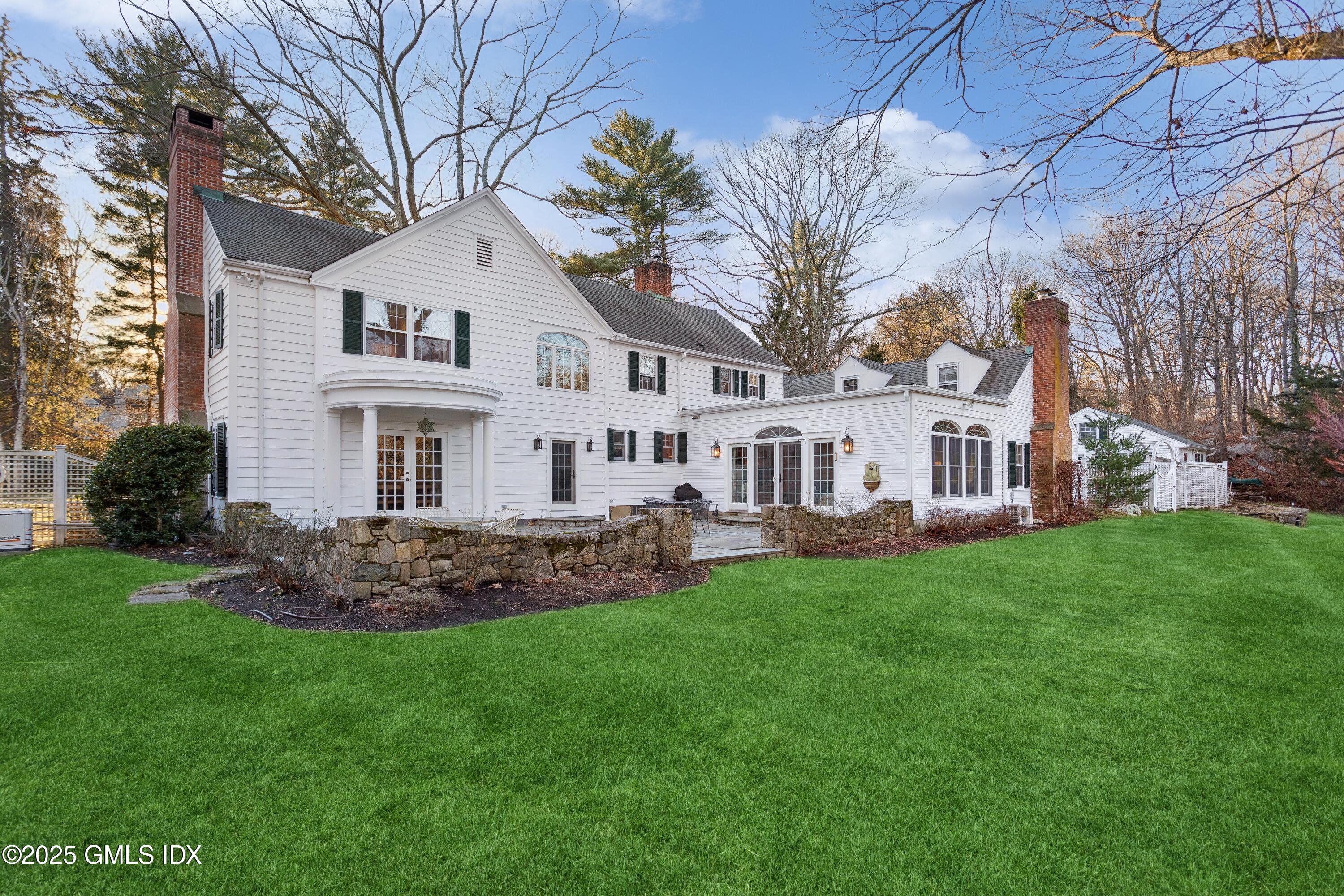 2 Laurel Road Stamford, CT 06903 - Photo 18 of 24 a view of a house with a yard and sitting area