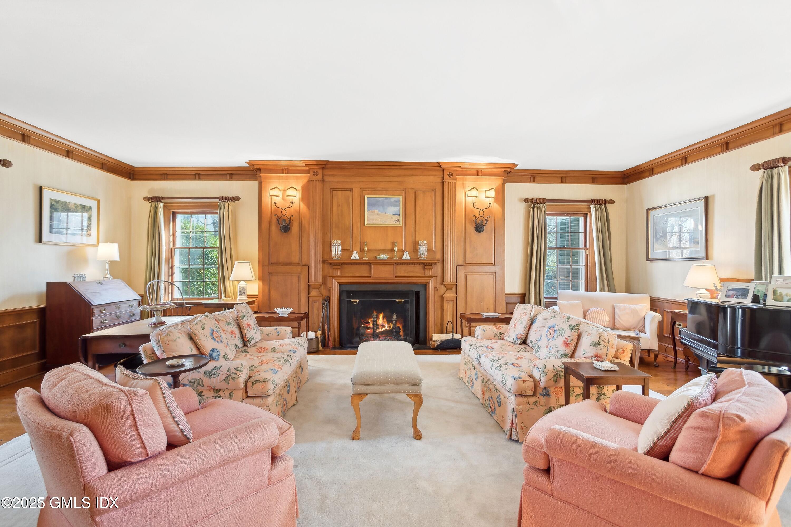 2 Laurel Road Stamford, CT 06903 - Photo 4 of 24 a living room with furniture large window and a fireplace