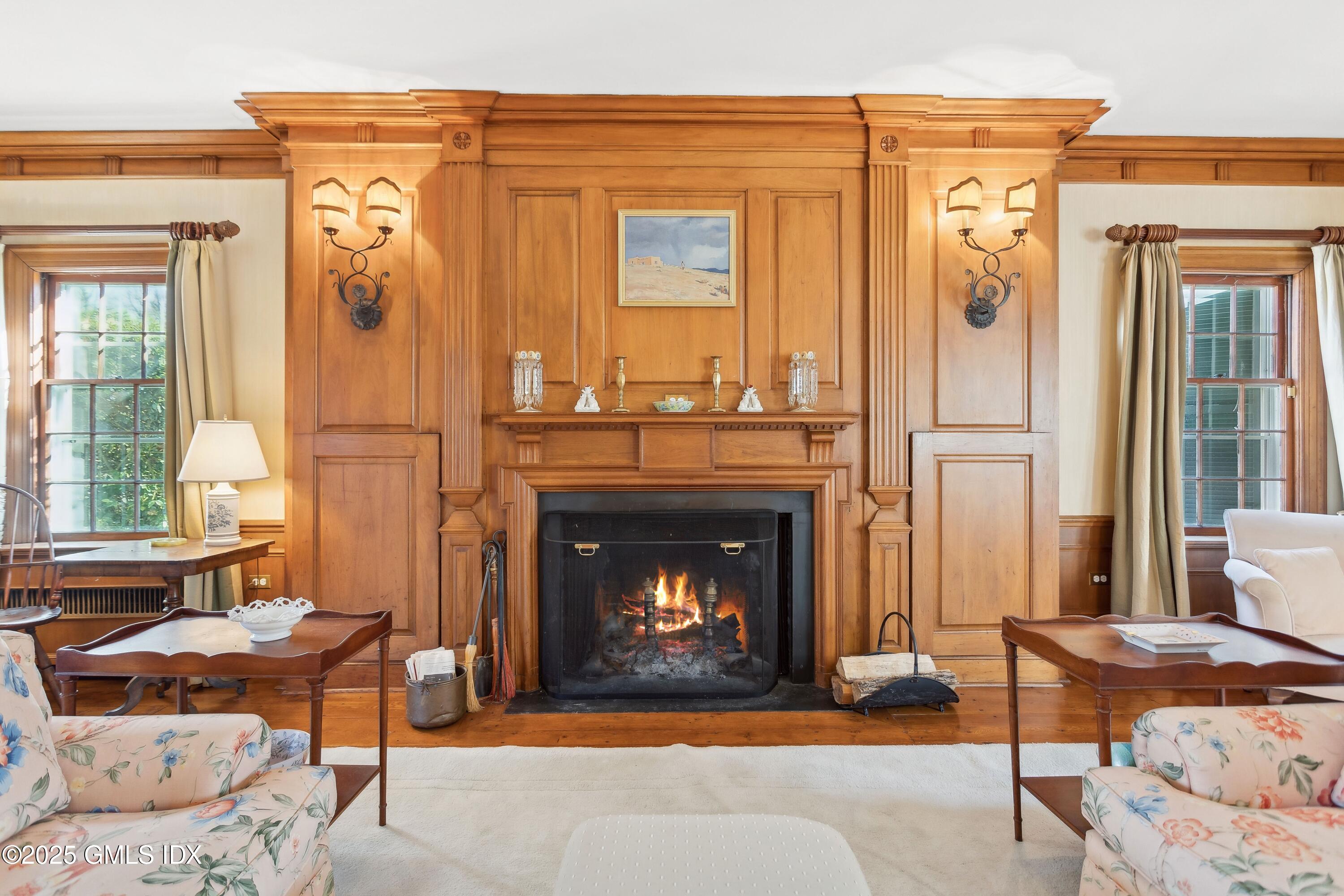 2 Laurel Road Stamford, CT 06903 - Photo 5 of 24 a living room with furniture and a fireplace