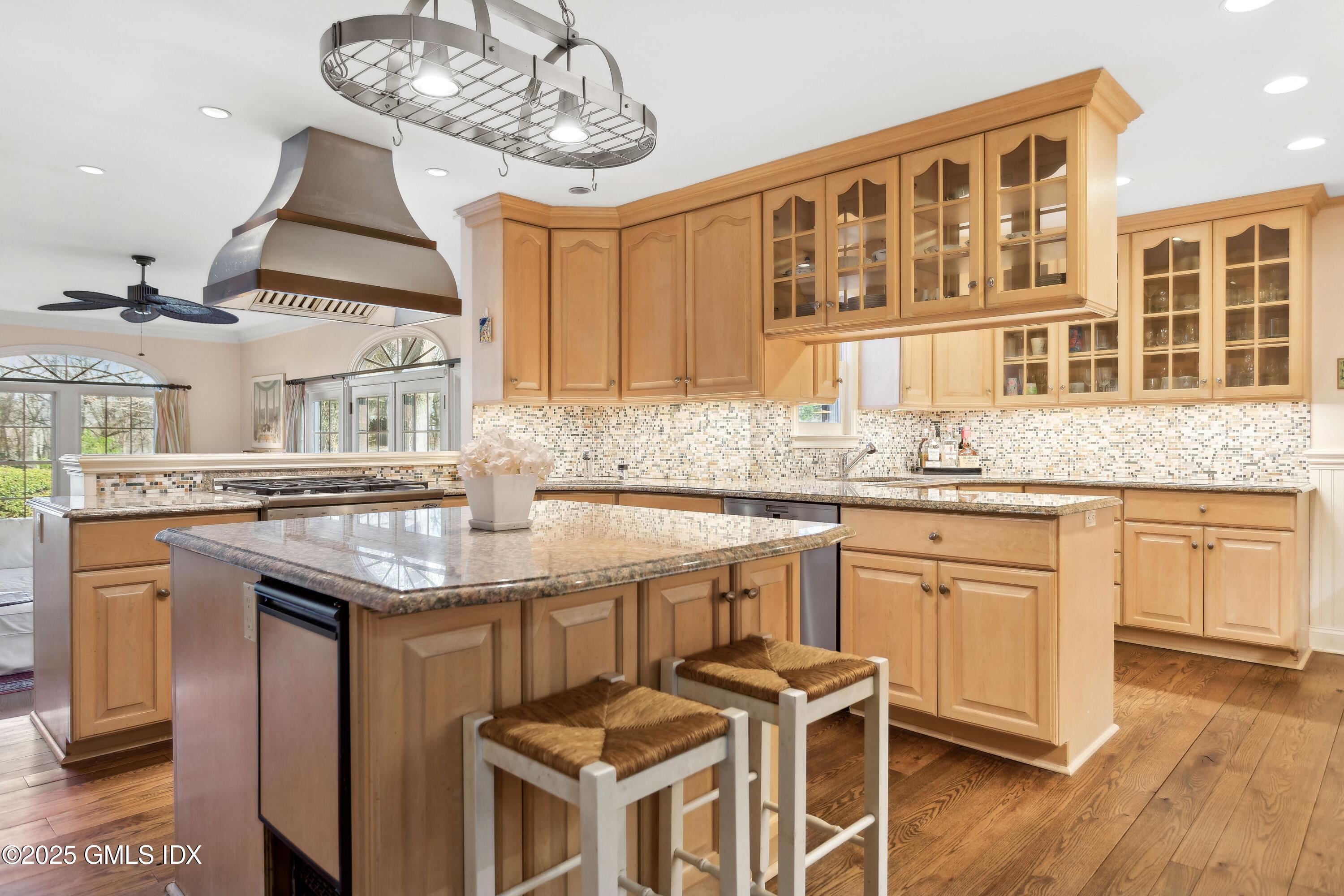 2 Laurel Road Stamford, CT 06903 - Photo 8 of 24 a kitchen with stainless steel appliances granite countertop a sink and cabinets