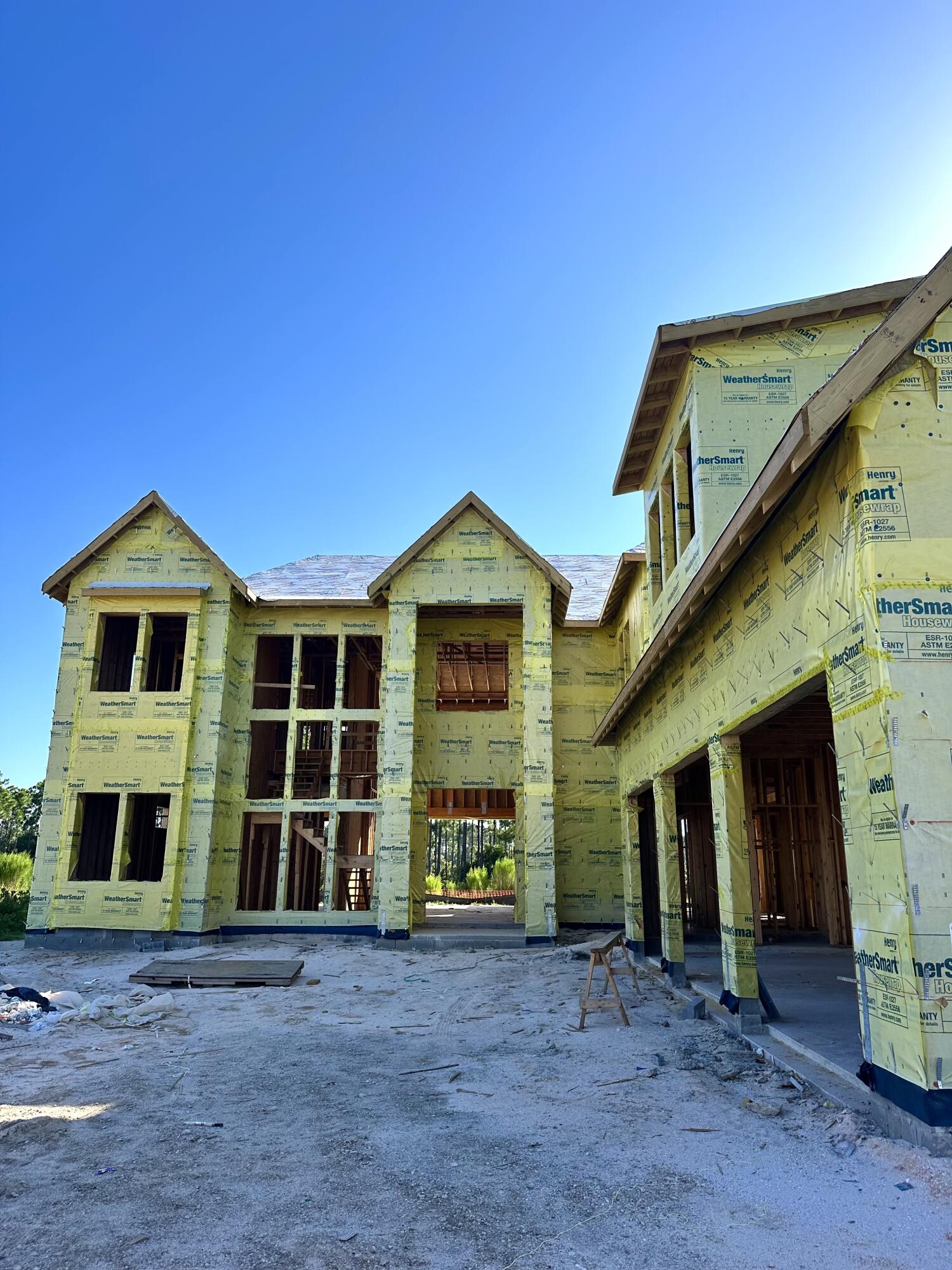 109 Norman Ct Inlet Beach Inlet Beach, FL 32461 - Photo 15 of 25 a view of a brick house with large windows and a yard