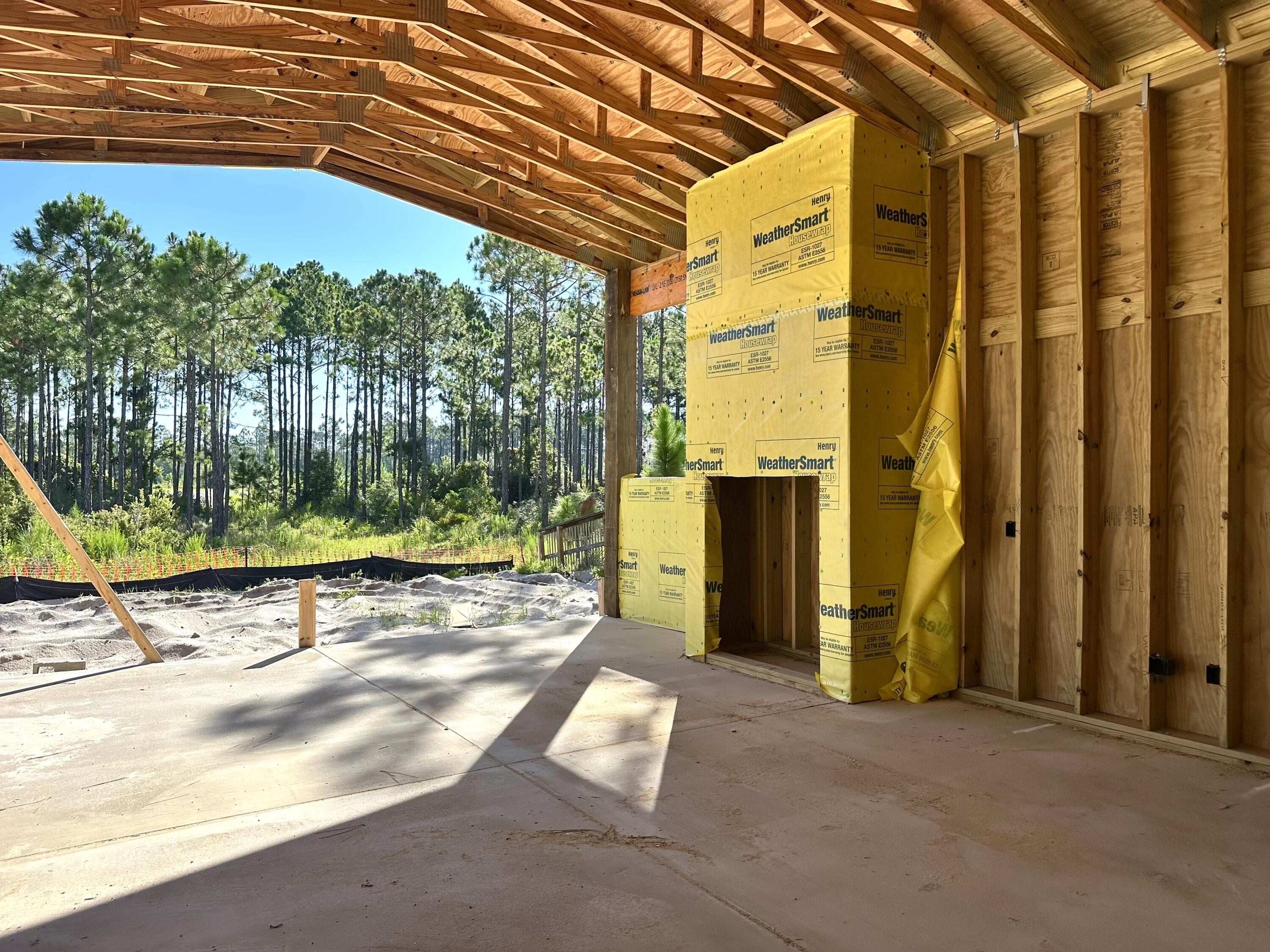 109 Norman Ct Inlet Beach Inlet Beach, FL 32461 - Photo 20 of 25 a view of backyard with tub and trees in the background