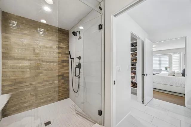 a bathroom with a shower and a tub