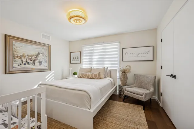 a bedroom with a bed and a couch