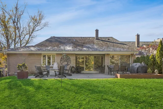 a front view of house with yard and outdoor seating