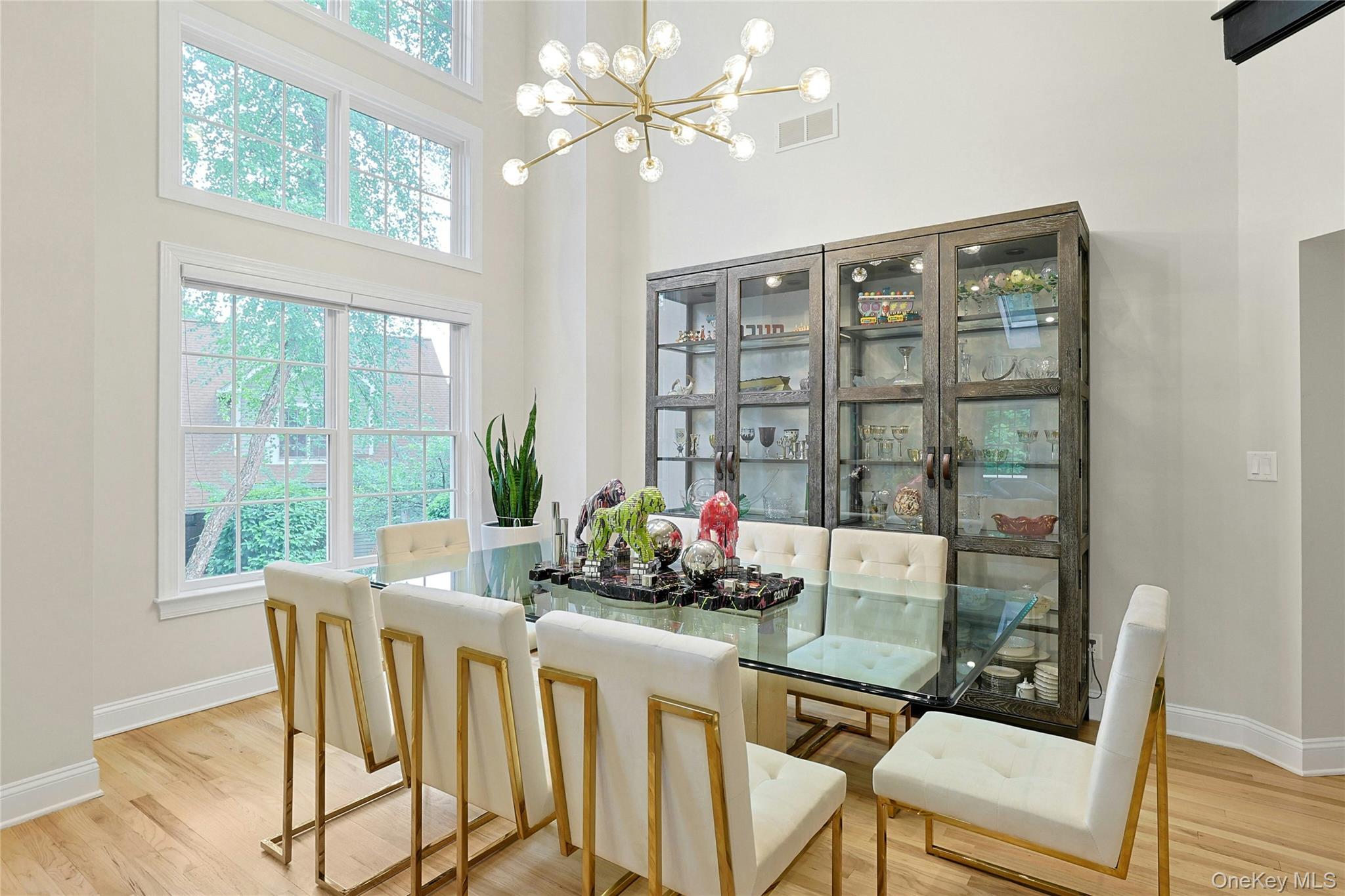 26 Agnew Farm Road Armonk, NY 10504 - Photo 12 of 28 a dining room with furniture a chandelier and window