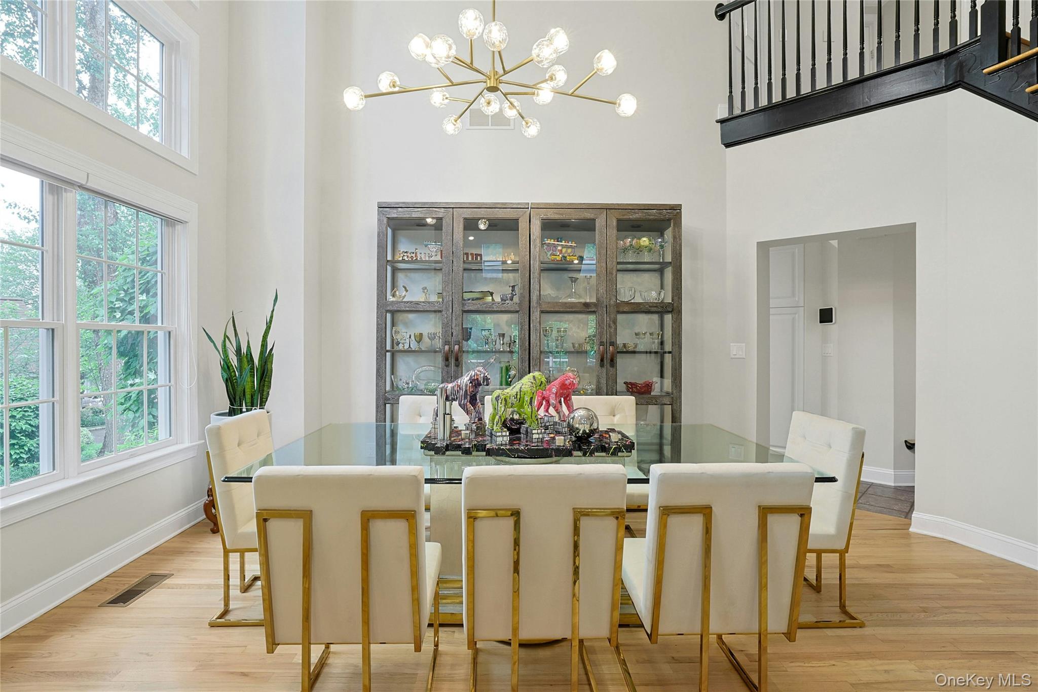 26 Agnew Farm Road Armonk, NY 10504 - Photo 13 of 28 a dining room with furniture a chandelier and wooden floor