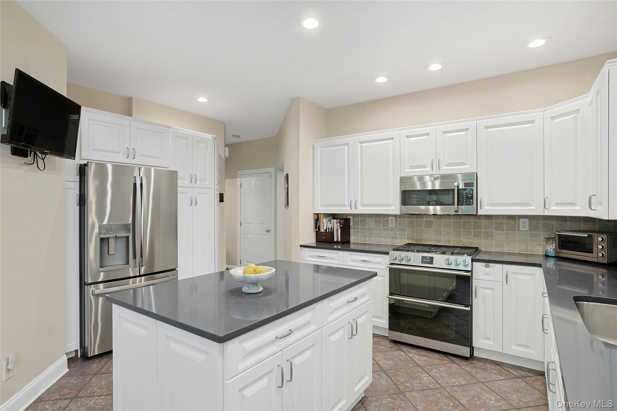 26 Agnew Farm Road Armonk, NY 10504 - Photo 16 of 28 a kitchen with stainless steel appliances a stove a sink and a refrigerator