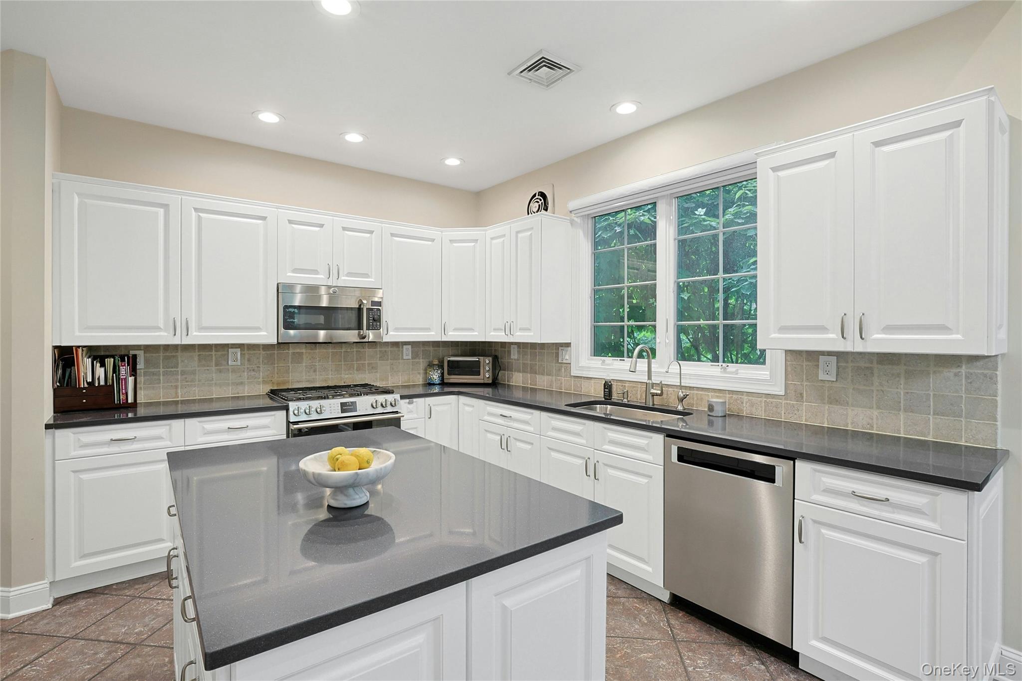26 Agnew Farm Road Armonk, NY 10504 - Photo 17 of 28 a kitchen with stainless steel appliances granite countertop a sink a stove and cabinets