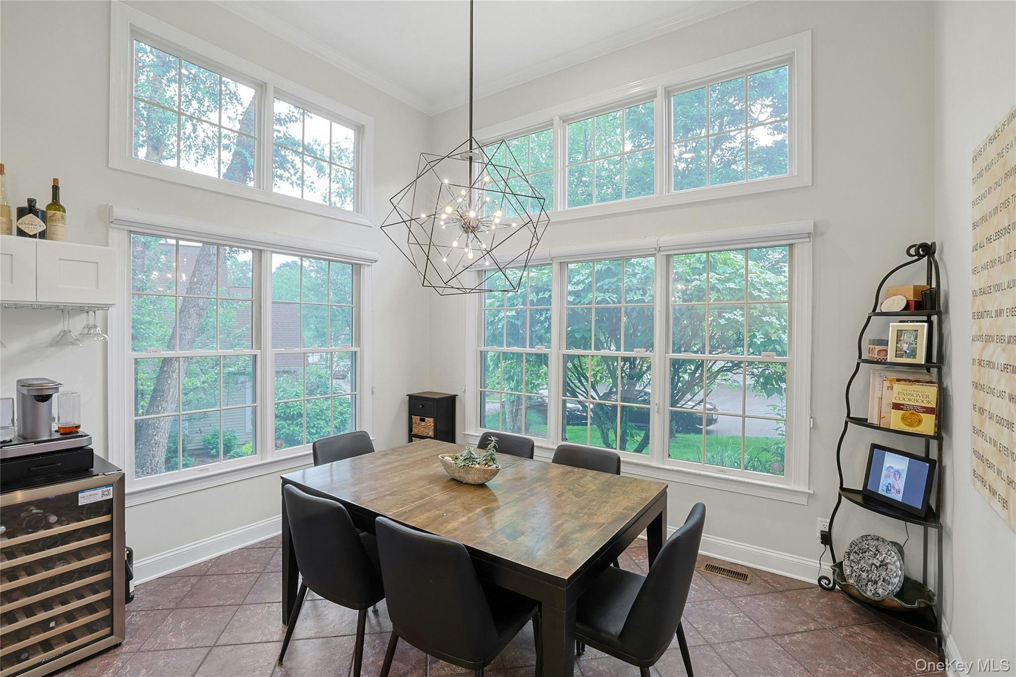 26 Agnew Farm Road Armonk, NY 10504 - Photo 18 of 28 a view of a dining room with furniture large windows and wooden floor