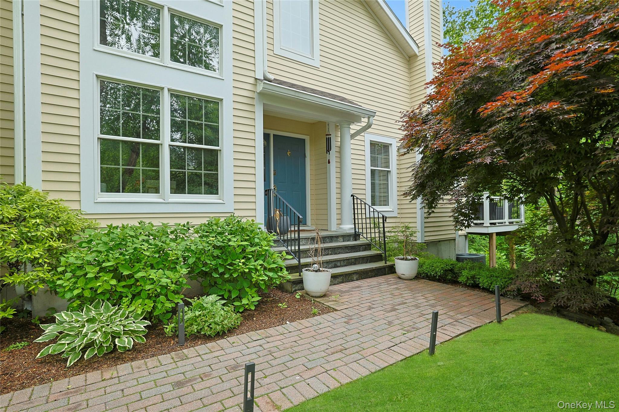 26 Agnew Farm Road Armonk, NY 10504 - Photo 2 of 28 a front view of a house with garden