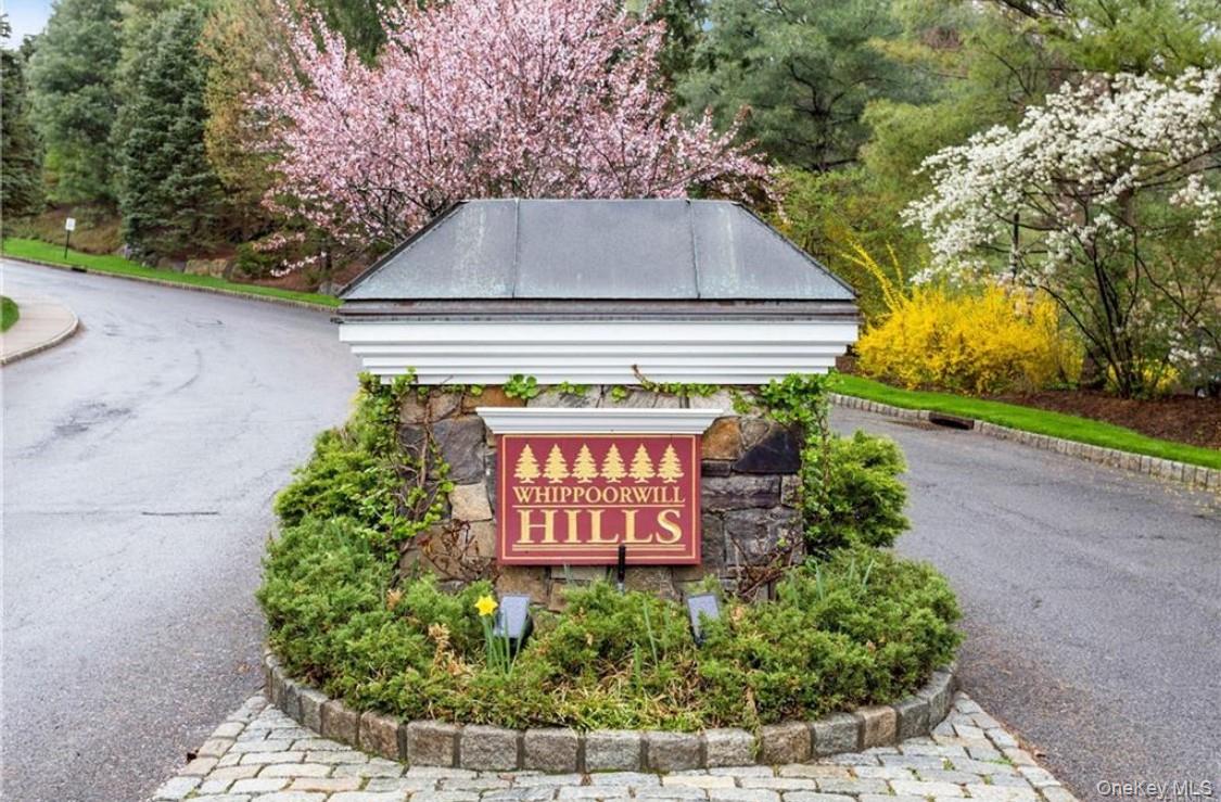 26 Agnew Farm Road Armonk, NY 10504 - Photo 23 of 28 a sign that is sitting on a brick wall