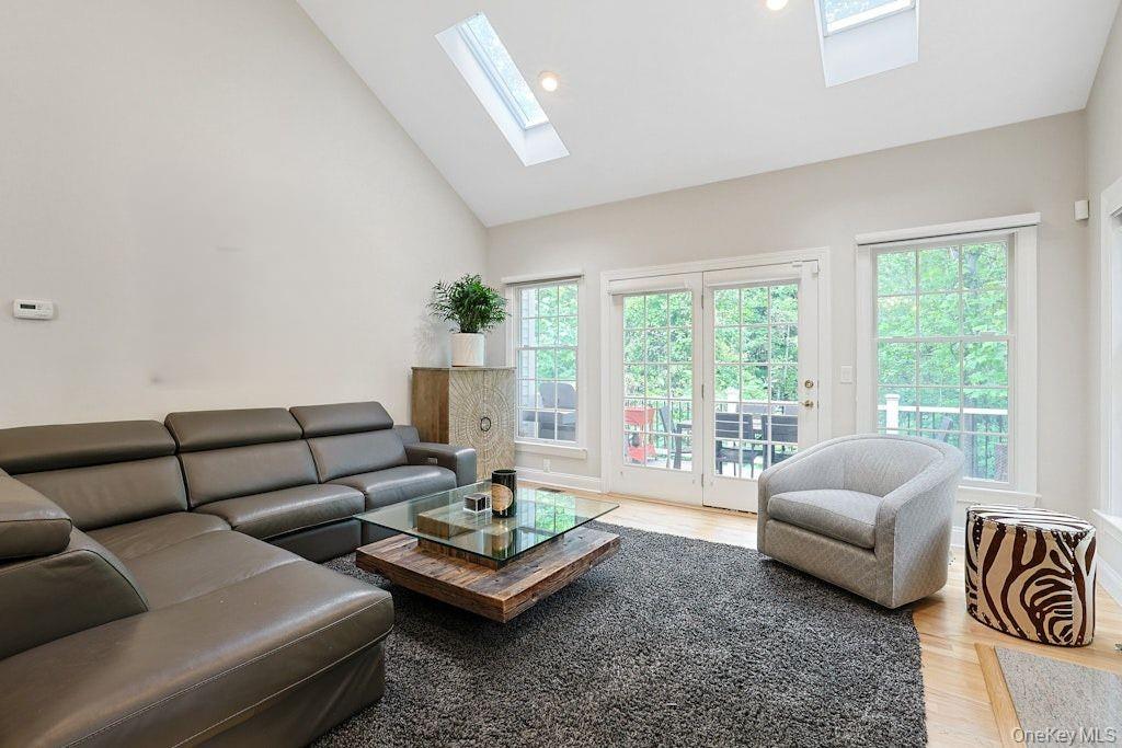 26 Agnew Farm Road Armonk, NY 10504 - Photo 8 of 28 a living room with furniture and a large window with outer view