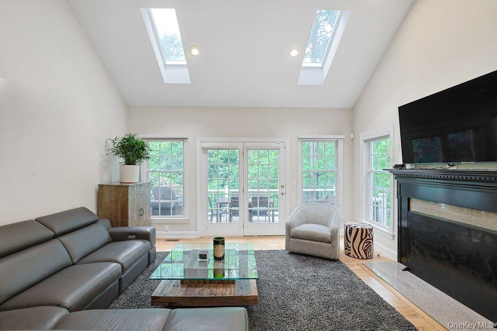 26 Agnew Farm Road Armonk, NY 10504 - Photo 9 of 28 a living room with furniture and a flat screen tv