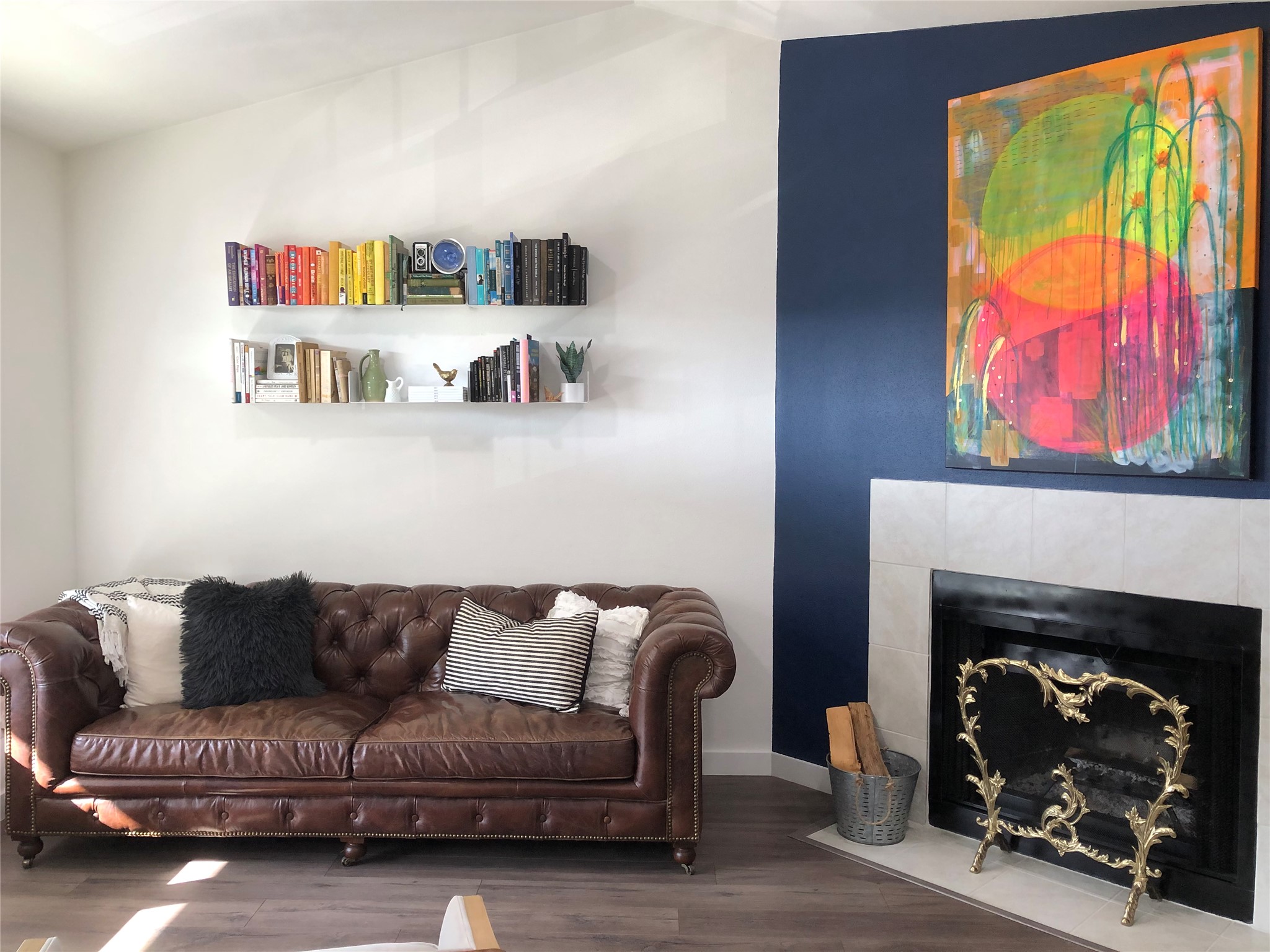 a living room with a couch and a fireplace