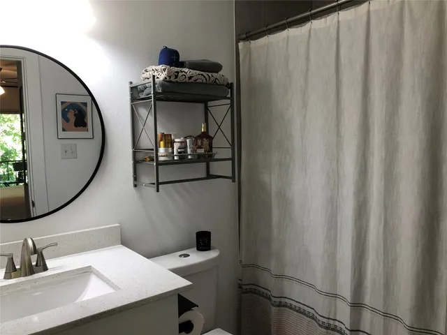 a bathroom with a sink and mirror