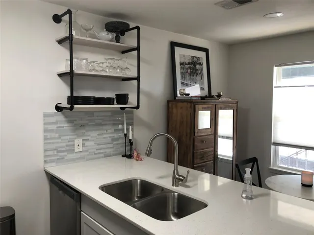 a kitchen with a sink and a window