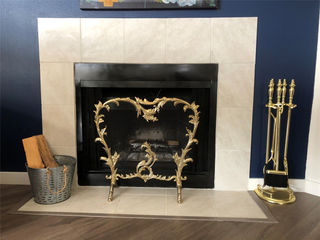 6409 Burns Street, Unit 306 Austin, TX 78752 - Photo 24 of 24 a living room with furniture and a fireplace