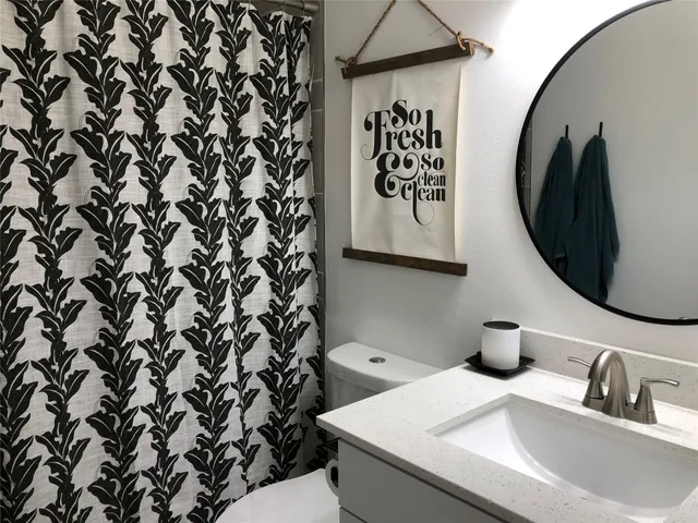 a bathroom with a toilet and a sink