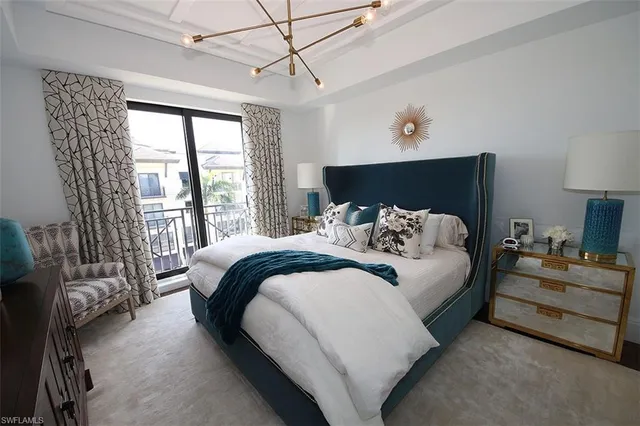 a bedroom with furniture and a window