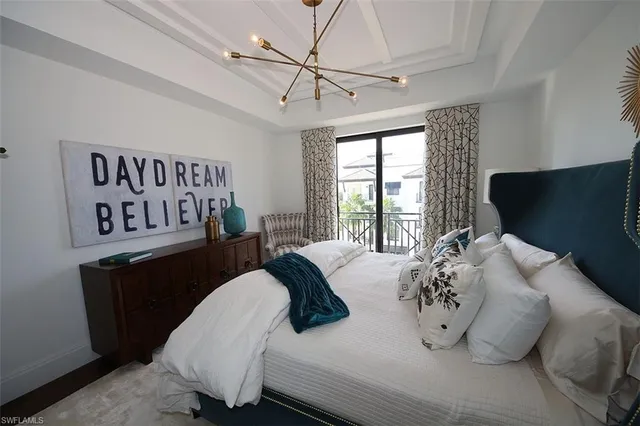 a bathroom with a double vanity sink a mirror and a bathtub